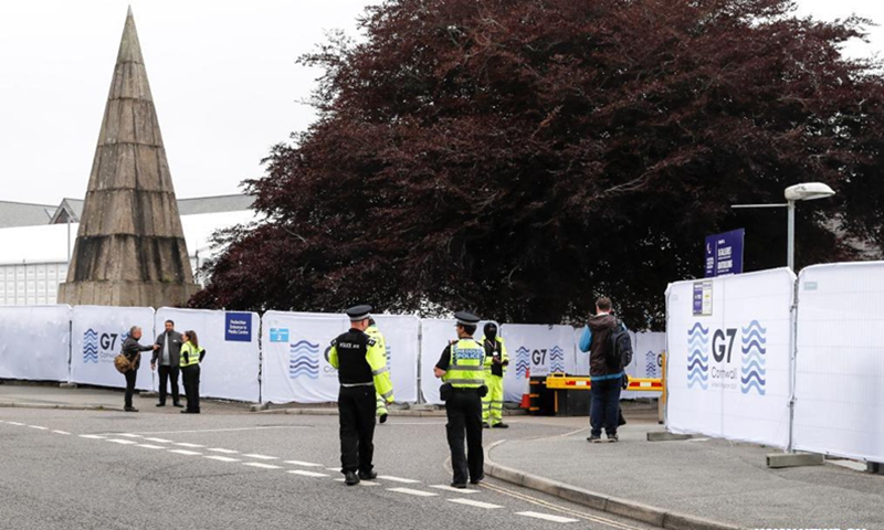 Police officers and security personnel work outside the G7 media center in Falmouth, Cornwall, Britain, on June 11, 2021. The first in-person G7 summit kicked off on Friday in Britain's southwestern resort of Carbis Bay, Cornwall, in almost two years. Photo:Xinhua