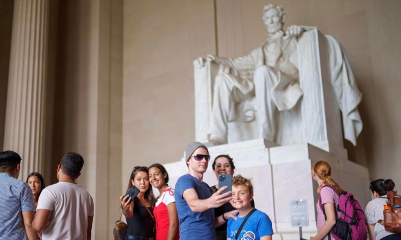 People visit the Lincoln Memorial at the National Mall in Washington D.C., the United States, June 12, 2021. (Photo by Ting Shen/Xinhua)