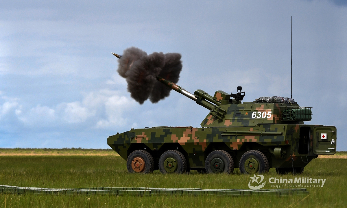 A wheeled self-propelled howitzer attached to a brigade under the PLA 80th Group Army fires a shell during a live-fire drill on June 4, 2021. (eng.chinamil.com.cn/Photo by Guo Daoxiong)
