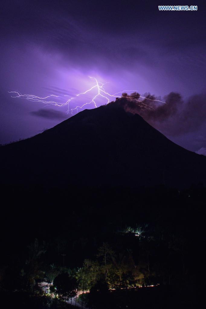 This long-time exposure photo taken on June 12, 2021 shows lightning striking near Mount Sinabung in North Sumatra, Indonesia. (Photo by Sarianto Sembiring/Xinhua)