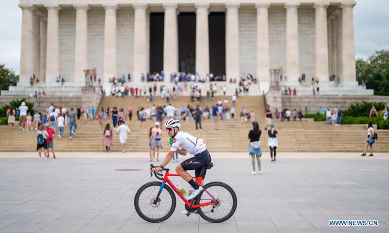A cyclist rides by the Lincoln Memorial at the National Mall in Washington D.C., the United States, June 12, 2021. (Photo by Ting Shen/Xinhua)