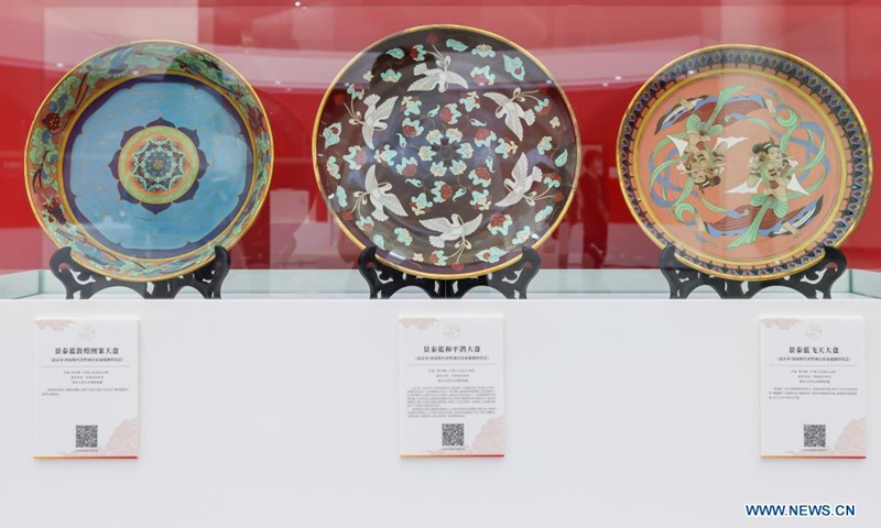 Cllisonne handicrafts are displayed at an exhibition held on the occasion of China's Cultural and Natural Heritage Day in Shanghai, east China, June 12, 2021. An exhibition of Chinese traditional handicrafts was held on Saturday, this year's Cultural and Natural Heritage Day. Since 2006, China has celebrated cultural heritage day on the second Saturday of June. In 2017, it was renamed Cultural and Natural Heritage Day. (Xinhua/Wang Xiang)