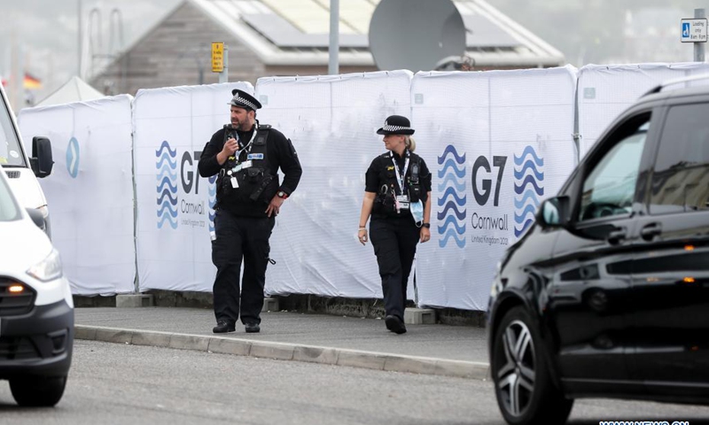 Police officers patrol outside the G7 media center in Falmouth, Cornwall, Britain, on June 11, 2021. The first in-person G7 summit kicked off on Friday in Britain's southwestern resort of Carbis Bay, Cornwall, in almost two years. Photo:Xinhua