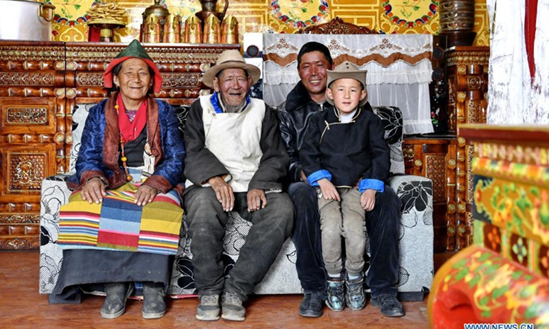 Sonam (2nd L) and his family pose for a photo at home in the county of Xaitongmoin, Xigaze City, southwest China's Tibet Autonomous Region, April 16, 2021. Photo:Xinhua
