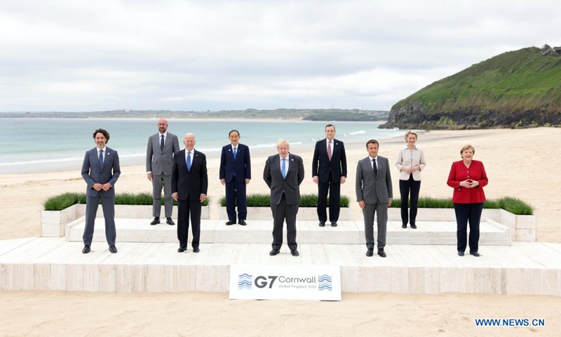 (From L to R, Front) Canadian Prime Minister Justin Trudeau, U.S. President Joe Biden, British Prime Minister Boris Johnson, French President Emmanuel Macron, German Chancellor Angela Merkel, (From L to R, Rear) European Council President Charles Michel, Japanese Prime Minister Yoshihide Suga, Italian Prime Minister Mario Draghi, and European Commission President Ursula von der Leyen, stand for a family photo during the Group of Seven (G7) Summit in Carbis Bay, Cornwall, Britain, on June 11, 2021. Photo:Xinhua