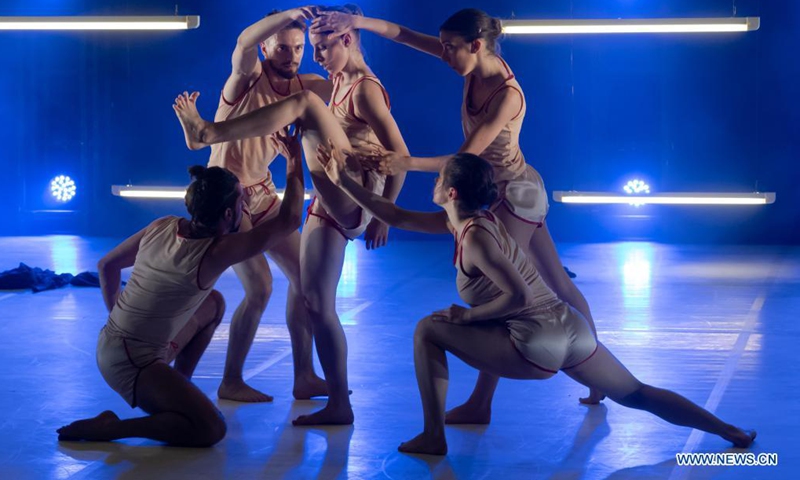 Members of Szeged Contemporary Dance Company perform their new piece Blue during a dress rehearsal at National Dance Theatre in Budapest, Hungary on June 11, 2021. (Photo by Attila Volgyi/Xinhua)