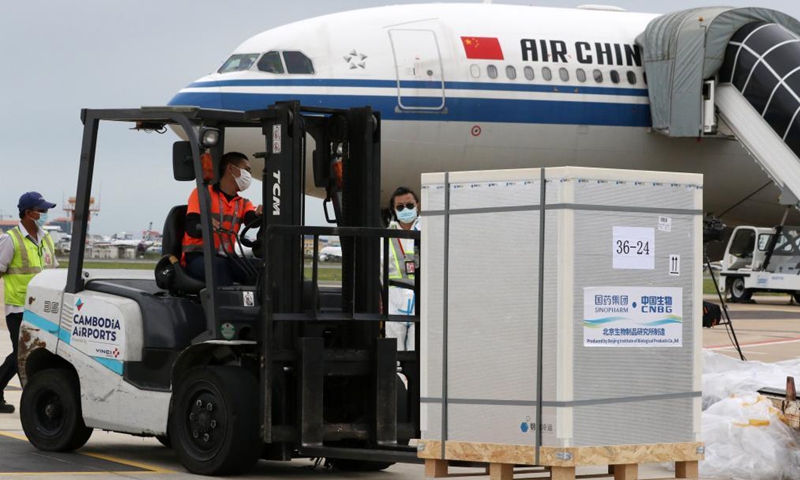 A worker transports a box of Chinese COVID-19 vaccines at the Phnom Penh International Airport in Phnom Penh, Cambodia, June 12, 2021.Photo:Xinhua