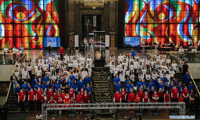 People wearing the tricolor T-shirts sing the Russian Anthem to celebrate the Russia Day at the Victory museum in Moscow, Russia, on June 12, 2021. Russia Day marks the date when the First Congress of People's Deputies of the Russian Federation adopted the Declaration of Russia's National Sovereignty in 1990.Photo:Xinhua