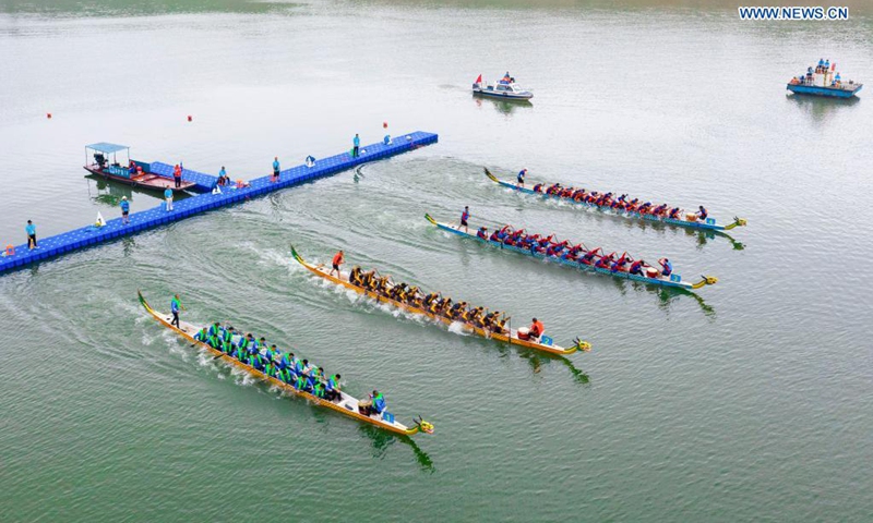 People participate in a dragon boat race to celebrate the Dragon Boat Festival in Zigui County, central China's Hubei Province, June 14, 2021. China celebrated the Dragon Boat Festival on Monday to commemorate Qu Yuan, a patriotic poet from the Warring States Period (475-221 BC) believed to have been born in Zigui County.(Photo: Xinhua)
