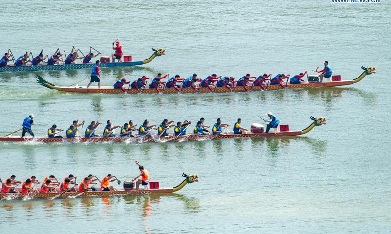 People participate in a dragon boat race to celebrate the Dragon Boat Festival in Zigui County, central China's Hubei Province, June 14, 2021. China celebrated the Dragon Boat Festival on Monday to commemorate Qu Yuan, a patriotic poet from the Warring States Period (475-221 BC) believed to have been born in Zigui County.(Photo: Xinhua)