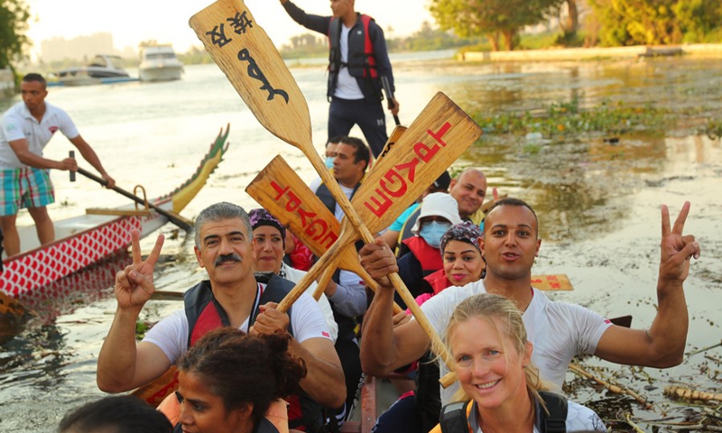 Paddlers from Dragon Boat Egypt Academy celebrate after a dragon boat race on the Nile in Cairo, Egypt, on June 14, 2021. (Photo: Xinhua)