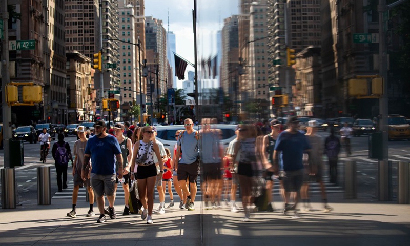People walk along the Street in New York, the United States, June 15, 2021. (Photo: Xinhua)