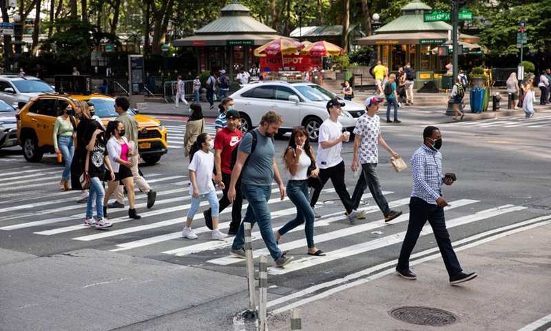 People walk along the Street in New York, the United States, June 15, 2021.(Photo: Xinhua)