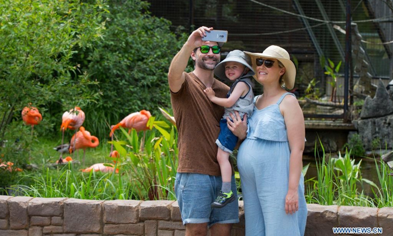 A family poses for a selfie at the Toronto Zoo in Toronto, Canada, on June 19, 2021. The Toronto Zoo officially reopened to the public on Saturday after being closed to visitors since November 23, 2020.(Photo: Xinhua)