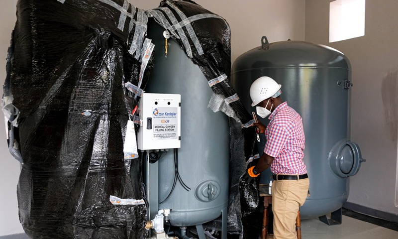 A technician assembles equipment during the installation of the new oxygen plant at Mulago Referral hospital in Kampala, Uganda, June 18, 2021.(Photo: Xinhua)