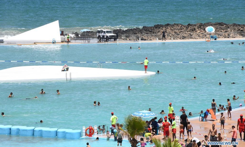 People enjoy summer time at the municipal swimming pool in Rabat, Morocco, on June 22, 2021. The municipal swimming pool of Rabat reopened recently.(Photo: Xinhua)