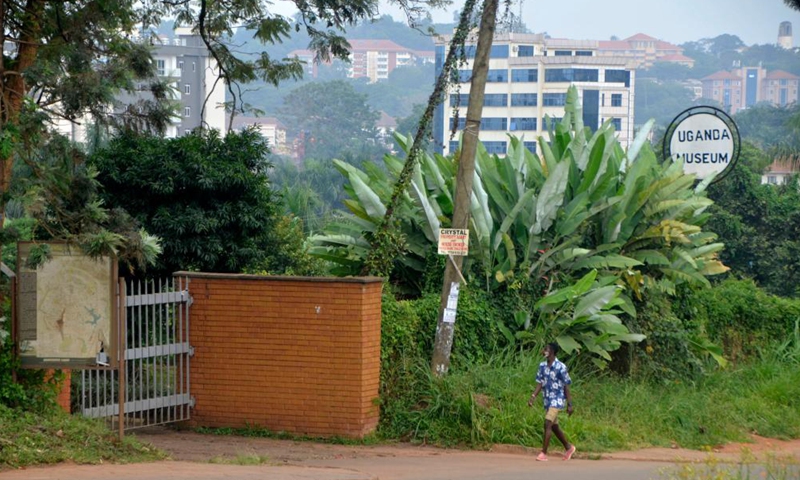 A man wearing a face mask walks past the closed gate of Uganda Museum in Kampala, Uganda, June 25, 2021. Uganda has suspended domestic tourism amid rising cases of COVID-19, a tourism official said here Friday. Uganda used to earn over 1.6 billion U.S. dollars annually from the tourism sector, but the country's tourism earnings in 2020 dropped by 73 percent due to the pandemic, according to the tourism ministry.Photo:Xinhua