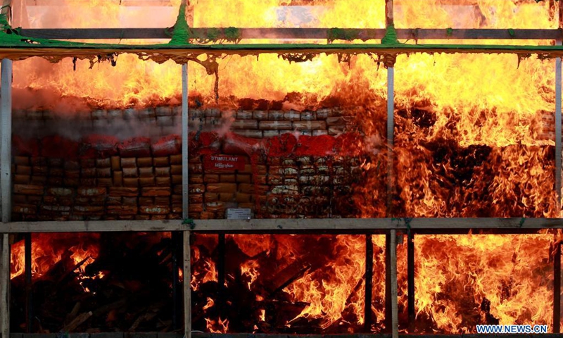 Seized drugs are burnt in Yangon, Myanmar, June 26, 2021. Myanmar ceremonially incinerated seized narcotic drugs in the cities of Yangon, Mandalay and Taunggyi on Saturday, marking the International Day against Drug Abuse and Illicit Trafficking. (Photo: Xinhua)