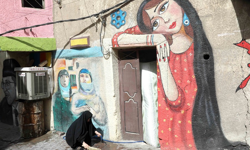 A drawing of a woman painted on the facade of a house in the old al-Anbariyen slum in Baghdad, Iraq, on June 2, 2021.(Photo: Xinhua)