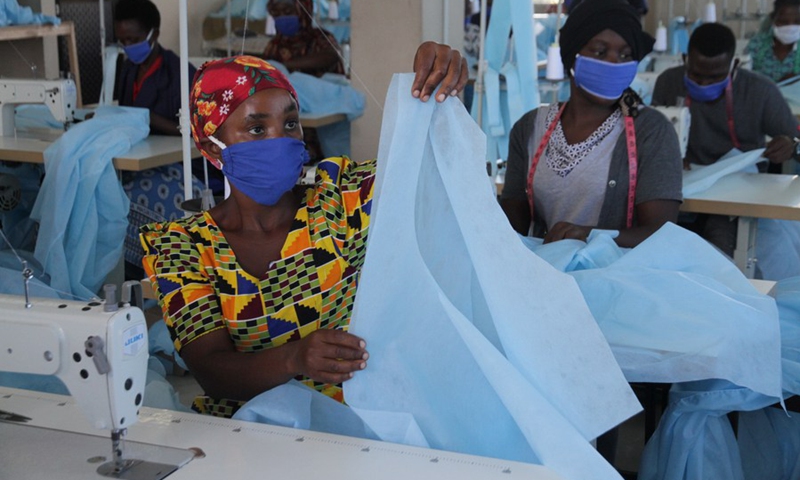 Workers make personal protective equipment (PPE) at a garment factory on the outskirts of Dar es Salaam, Tanzania, on May 13, 2020.(Photo: Xinhua)