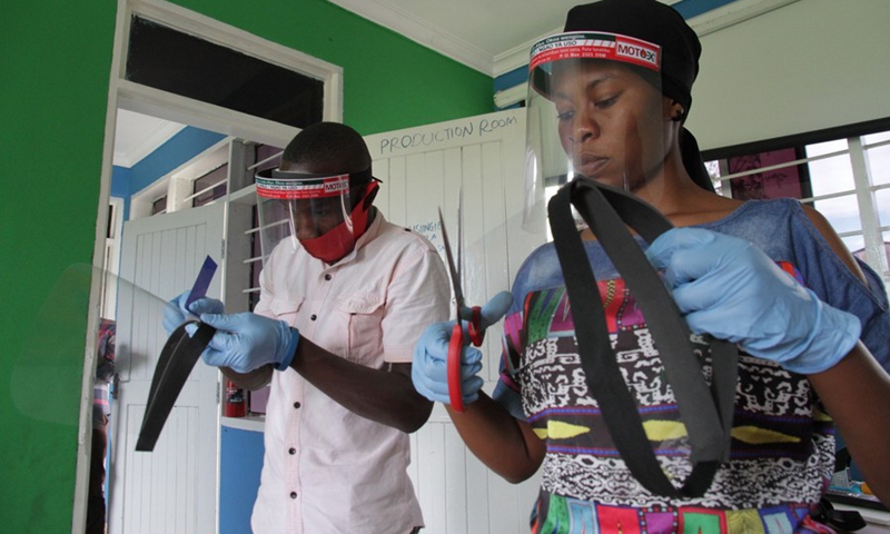 Workers make face shields at a recycling workshop during the fight against the spread of COVID-19 in Dar es Salaam, Tanzania on June 18, 2020.(Photo: Xinhua)