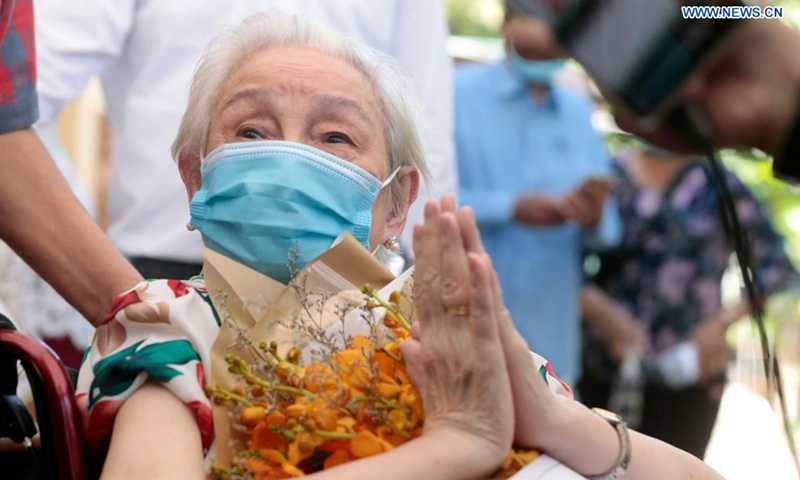 Ho Kham, a 101-year-old Cambodian woman, is seen at an inoculation site in Phnom Penh, Cambodia on July 2, 2021. Ho Kham has become one of the oldest persons in Cambodia to be fully vaccinated with two doses of China's Sinovac COVID-19 vaccine.Photo:Xinhua