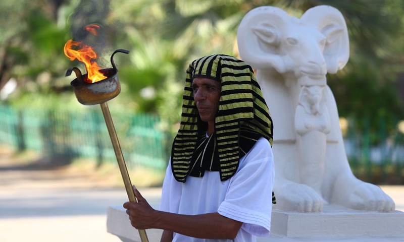 A man wearing a pharaonic costume performs during a pharaonic wedding ceremony held to revitalize tourism affected by the COVID-19 pandemic at Pharaonic Village in Giza, Egypt, on July 5, 2021.(Photo: Xinhua)