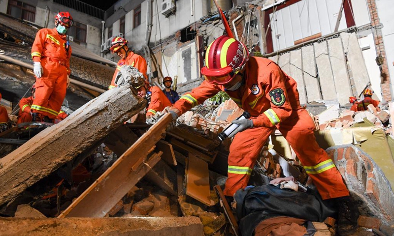 Rescuers work at the site of a collapsed building in Suzhou, east China's Jiangsu Province, July 12, 2021. One person died, and another 10 people are missing after a building collapsed Monday in east China's Jiangsu Province, local authorities said. The incident happened at around 3:33 p.m. Monday at a hotel in Wujiang District in the city of Suzhou, the district government said. (Photo: Xinhua)