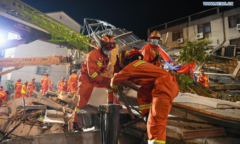 Rescuers work at the site of a collapsed building in Suzhou, east China's Jiangsu Province, July 12, 2021. One person died, and another 10 people are missing after a building collapsed Monday in east China's Jiangsu Province, local authorities said. The incident happened at around 3:33 p.m. Monday at a hotel in Wujiang District in the city of Suzhou, the district government said. (Photo: Xinhua)