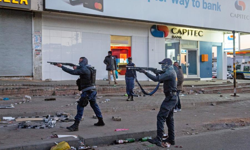 Police officers are positioned to deal with looting in Johannesburg, South Africa, on July 12, 2021. (Photo: Xinhua)