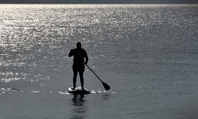 A man enjoys his leisure time at Ohrid Lake in Ohrid, North Macedonia on July 16, 2021.(Photo: Xinhua)