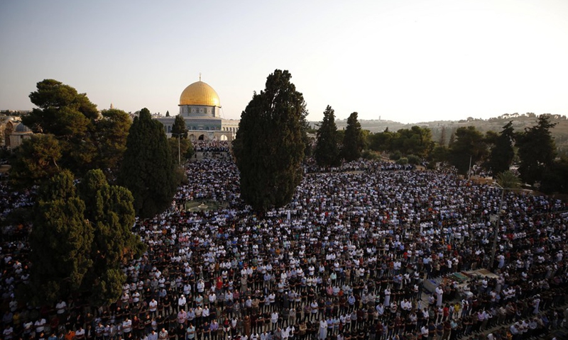 Thousands of Muslim worshipers attend Eid al-Adha prayer next to the Dome of the Rock in Jerusalem's Old City on July 20, 2021.(Photo: Xinhua)