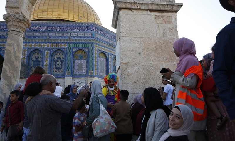 Thousands of Muslim worshipers attend Eid al-Adha prayer next to the Dome of the Rock in Jerusalem's Old City on July 20, 2021.(Photo: Xinhua)