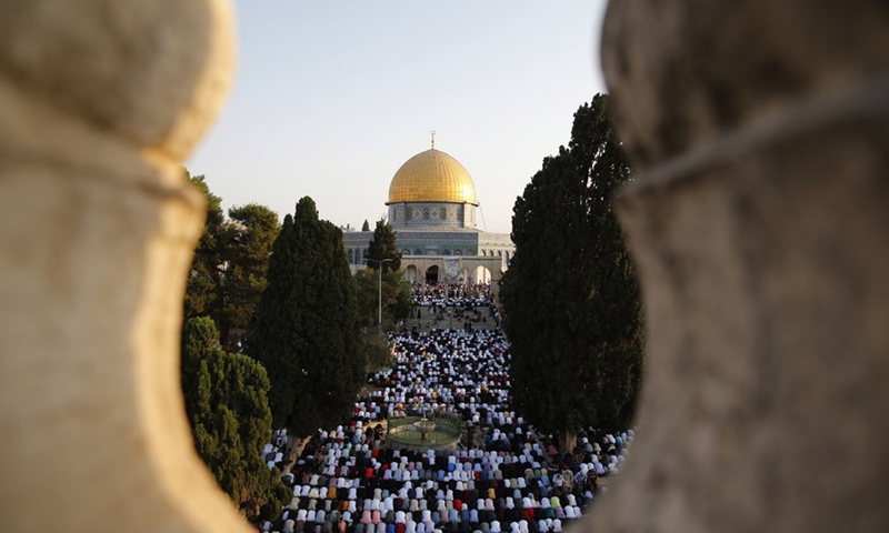 Thousands of Muslim worshipers attend Eid al-Adha prayer next to the Dome of the Rock in Jerusalem's Old City on July 20, 2021.(Photo: Xinhua)