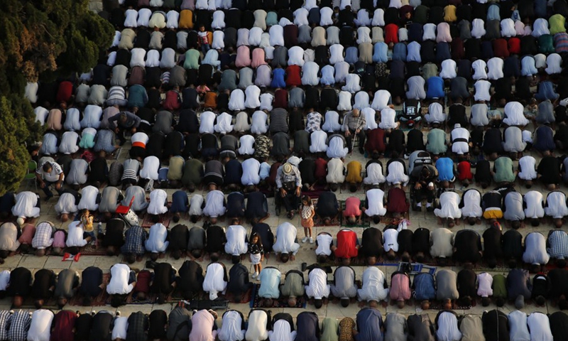 Thousands of Muslim worshipers attend Eid al-Adha prayer next to the Dome of the Rock in Jerusalem's Old City on July 20, 2021.(Photo: Xinhua)