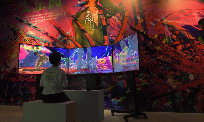 A visitor interacts with a digital art installation during the 2021 Asia Digital Art Exhibition at the Times Art Museum in Beijing, capital of China, July 23, 2021.Photo:Xinhua