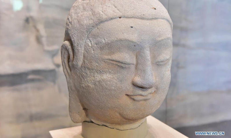 Photo taken on July 24, 2021 shows a stone Buddha head of a statue, which belongs to Cave 8 of the Tianlong Mountain Grottoes, at the Tianlong Mountain Grottoes Museum in Taiyuan, north China's Shanxi Province.Photo:Xinhua