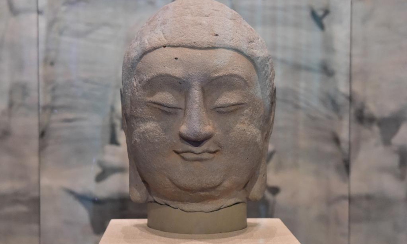 Photo taken on July 24, 2021 shows a stone Buddha head of a statue, which belongs to Cave 8 of the Tianlong Mountain Grottoes, at the Tianlong Mountain Grottoes Museum in Taiyuan, north China's Shanxi Province.Photo:Xinhua