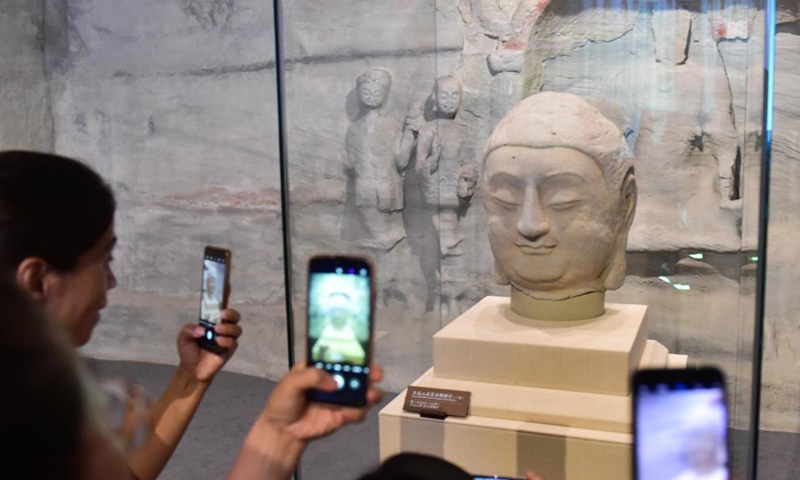 Photo taken on July 24, 2021 shows a stone Buddha head of a statue, which belongs to Cave 8 of the Tianlong Mountain Grottoes, at the Tianlong Mountain Grottoes Museum in Taiyuan, north China's Shanxi Province.Photo:Xinhua