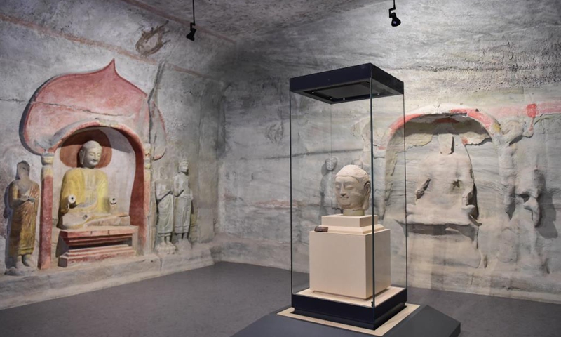 Photo taken on July 24, 2021 shows a stone Buddha head of a statue, which belongs to Cave 8 of the Tianlong Mountain Grottoes, at the Tianlong Mountain Grottoes Museum in Taiyuan, north China's Shanxi Province.Photo:Xinhua