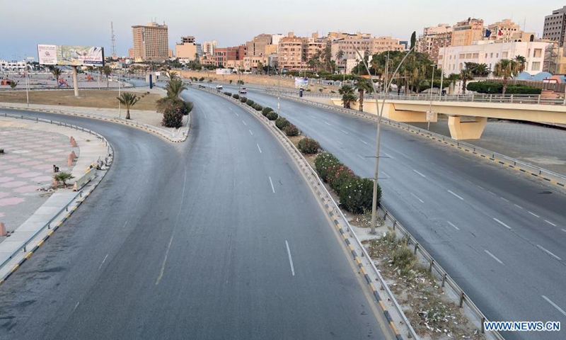 Photo taken on July 28, 2021 shows an almost empty road during curfew hours in Tripoli, Libya. The Libyan Government on Monday imposed a curfew due to increasing COVID-19 infections, while the nationwide vaccination continues. The curfew will last for two weeks from 6 p.m. to 6 a.m.(Photo: Xinhua)
