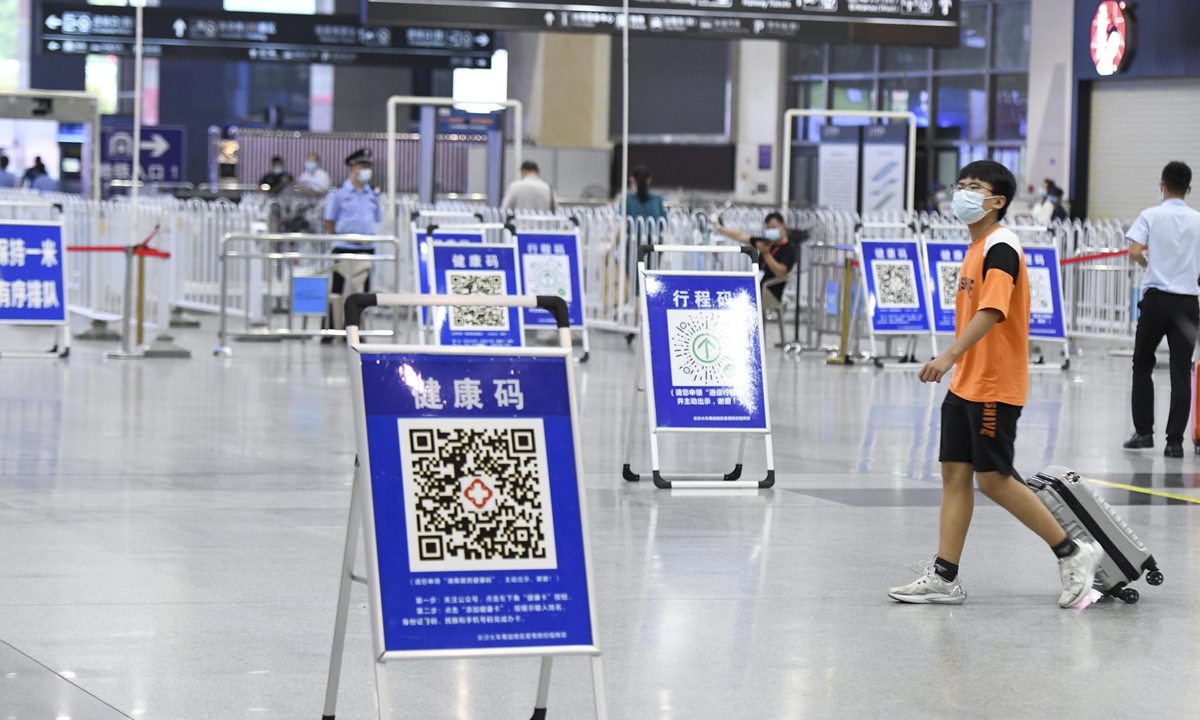 The Changsha railway station in Central China’s Hunan Province set up signs for passengers to scan their QR health codes on Friday, as Hunan clamped down after the Nanjing airport outbreak spread to at least 13 cities. Photo: cnsphoto