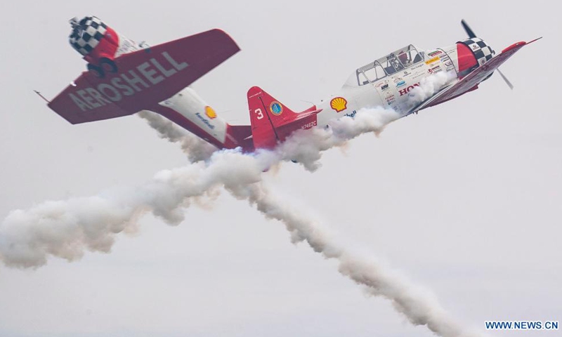 Members of an aerobatic team perform at the Experimental Aircraft Association (EAA) AirVenture 2021 in Oshkosh, Wisconsin, the United States, July 30, 2021. The EAA AirVenture, an annual air show that gathers aviation enthusiasts, is ongoing from July 26 to Aug. 1, 2021.Photo:Xinhua