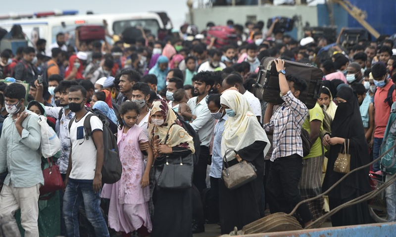 People get off a ferry at a terminal in Munshiganj on the outskirts of Dhaka, Bangladesh, on July 31, 2021.(Photo: Xinhua)