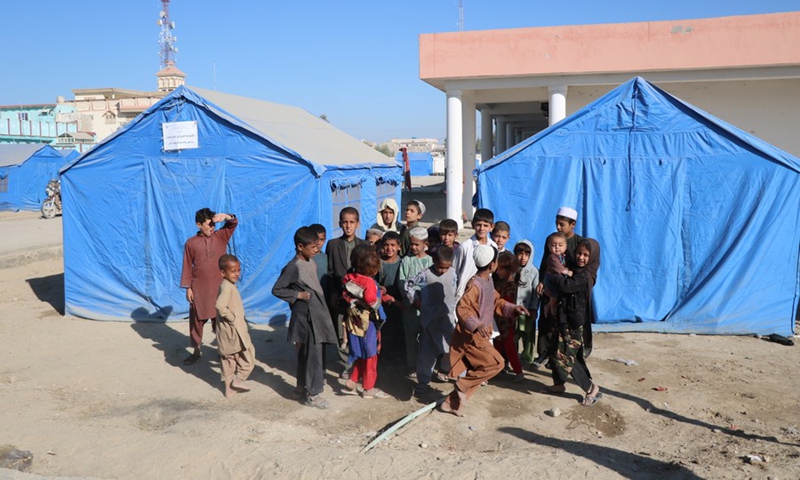 Children pose for photos at a camp for displaced people in Lashkar Gah, capital of Helmand province, Afghanistan, Oct. 28, 2020.(Photo: Xinhua)