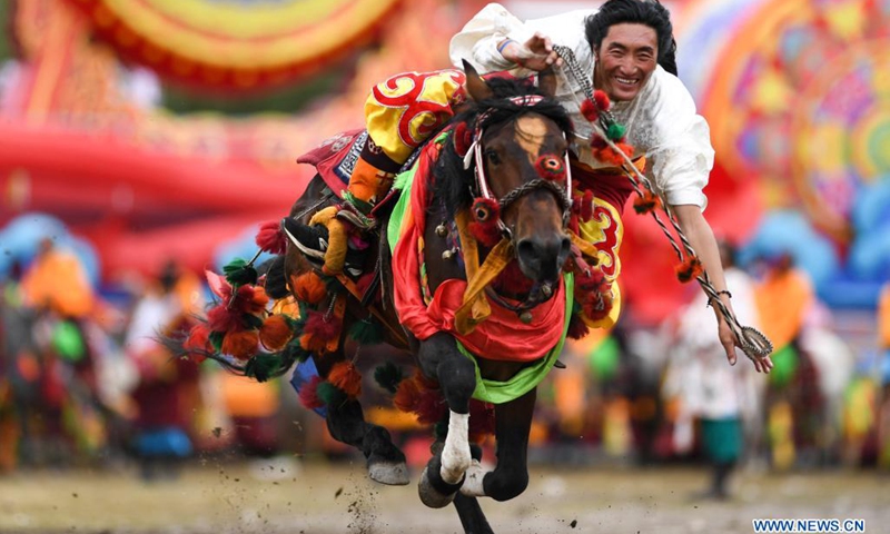 A local resident performs traditional horse racing during a celebration marking the 70th anniversary of the founding of Yushu Tibetan Autonomous Prefecture, in northwest China's Qinghai Province, Aug. 4, 2021.(Photo: Xinhua)