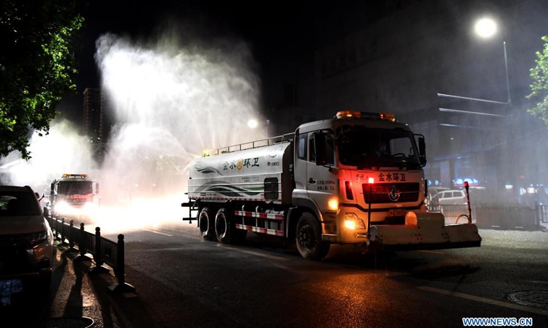 Vehicles disinfect a street to curb the lastest resurgence of COVID-19 in Zhengzhou, central China's Henan Province, Aug. 6, 2021.Photo:Xinhua