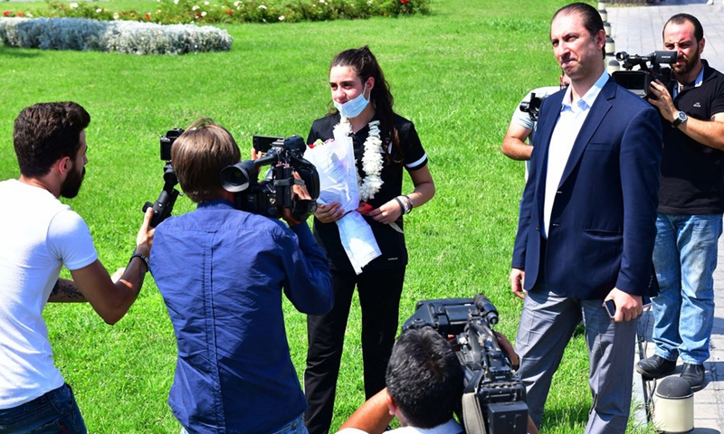Hend Zaza, a Syrian table tennis player, is seen speaking to the media upon arriving in Syrian capital Damascus on Aug. 2, 2021.(Photo: Xinhua)