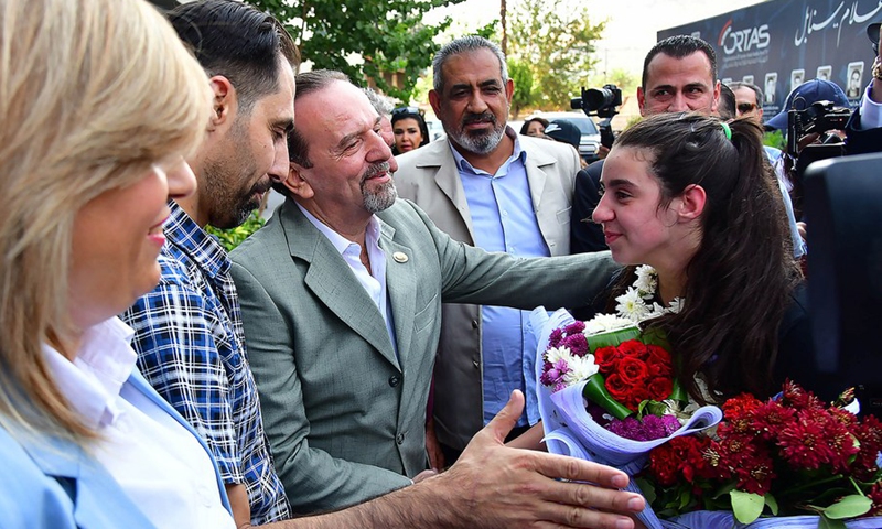 Hend Zaza, a Syrian table tennis player, is welcomed upon arriving in Syrian capital Damascus on Aug. 2, 2021. (Photo: Xinhua)