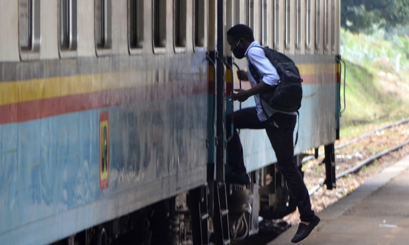 A passenger gets on a train in Kampala, Uganda, on Aug. 9, 2021.(Photo: Xinhua)